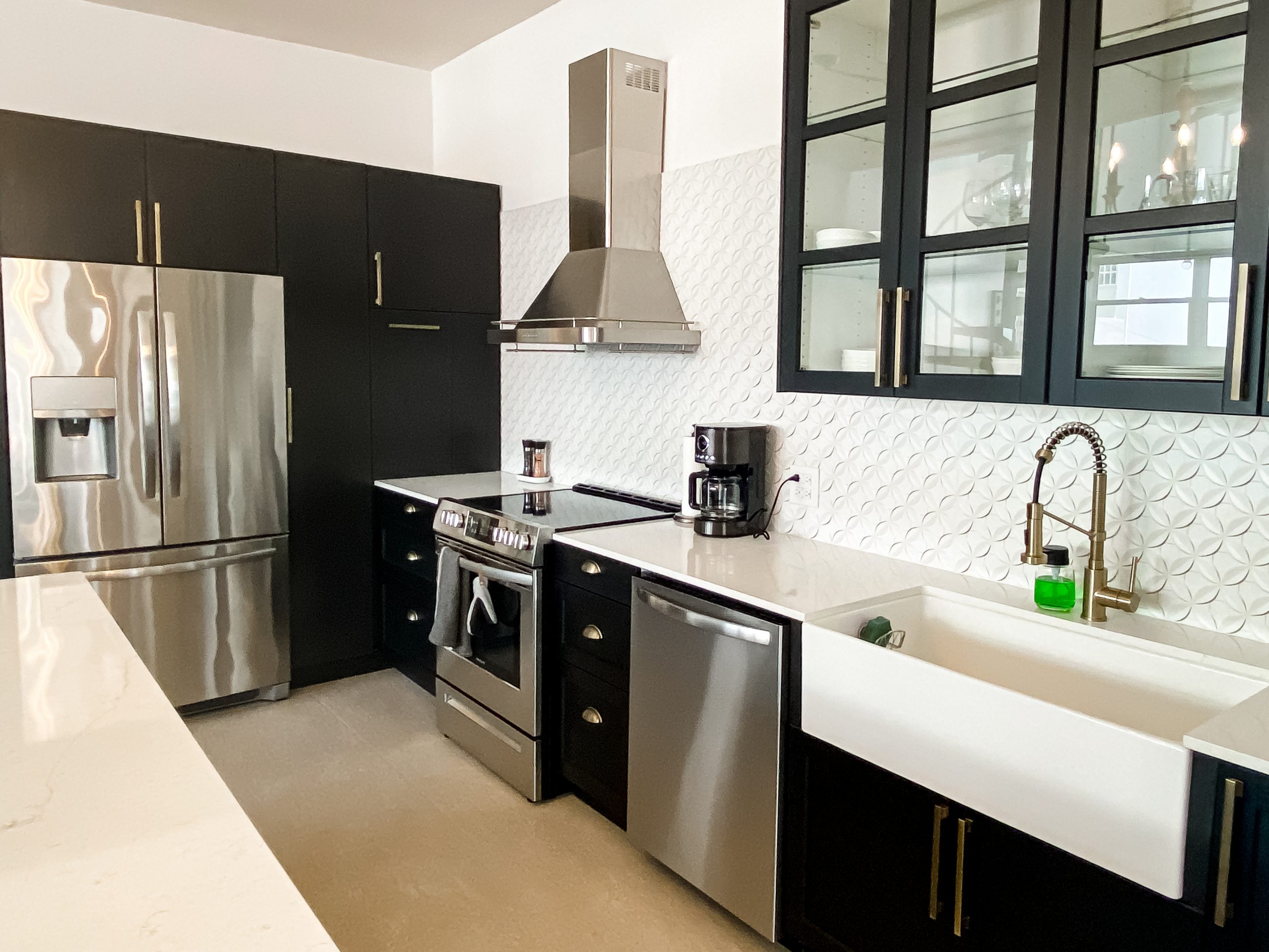 two patrons enjoy a cocktail in a cabana