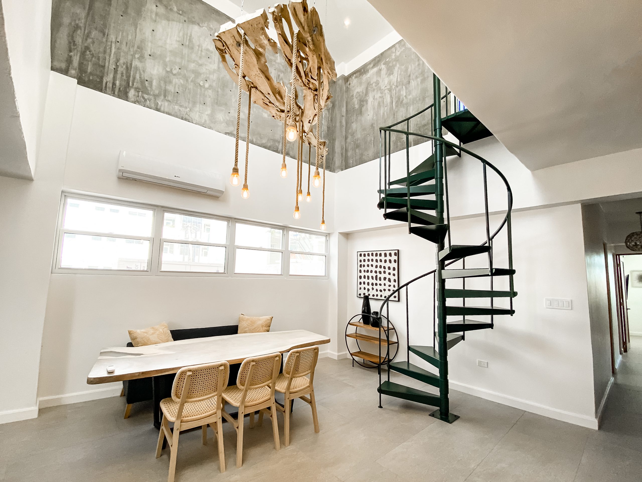 two patrons enjoy cocktails poolside